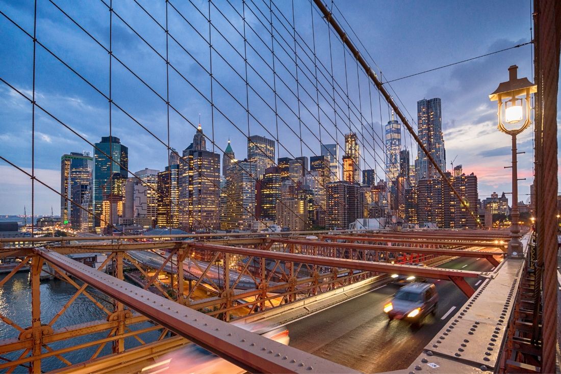 New York direct flights from Cayman see the Brooklyn Bridge